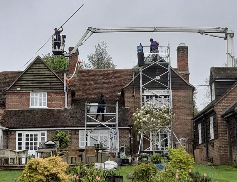 The Roof Moss Cleaners using cherry picker and scaffolding to clean roof safely and professionally in Eynsham, Oxfordshire