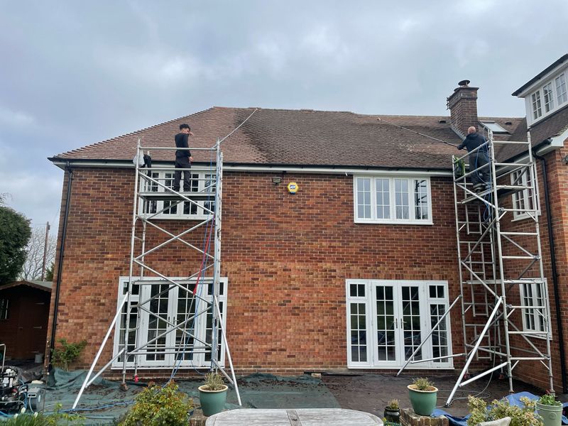 Roof cleaning carried out safely from scaffold towers by The Roof Moss Cleaners in Eynsham